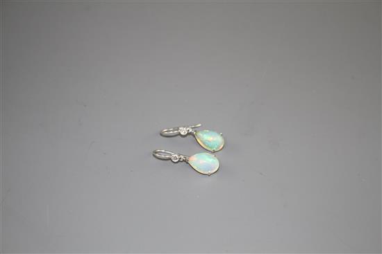 A pair of white metal, pear shaped white opal and diamond set drop earrings, opals approx. 12mm, gross weight 2.7 grams.